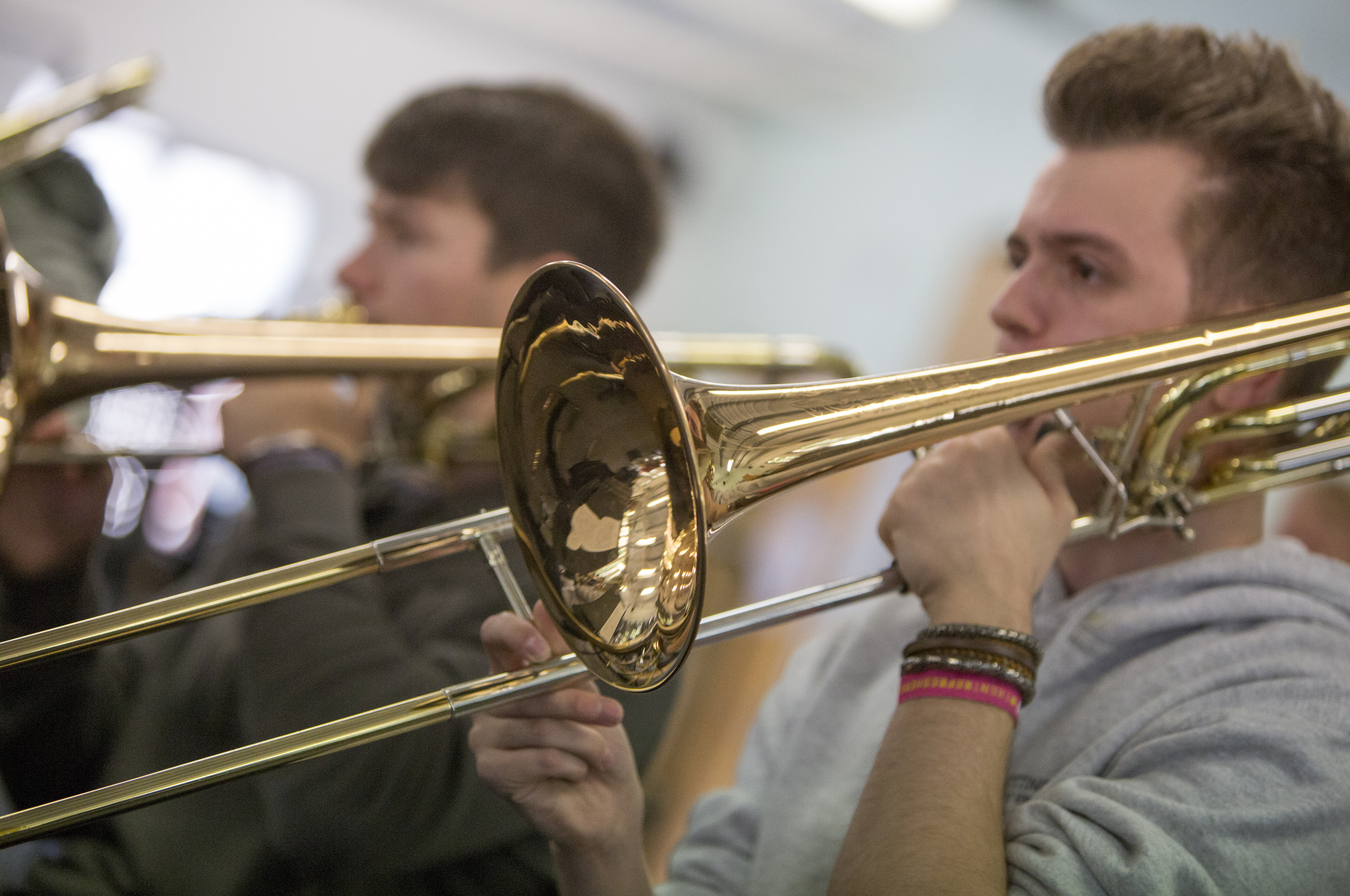 Male student playing trombone
